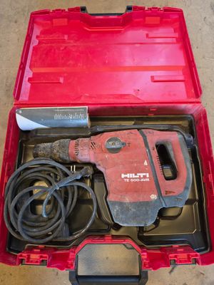 an image of a red tool box with tools in it