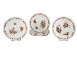trois assiettes marron et blanches ornées d'oiseaux et de fleurs