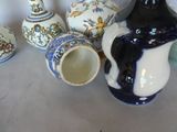 a lot of different vases that are on the table