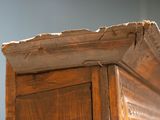 a close up of a wooden bed frame with a wooden headboard