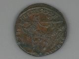 an old coin with a bird on it sitting on top of a table