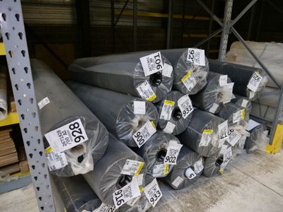 a large pile of steel pipes in a warehouse