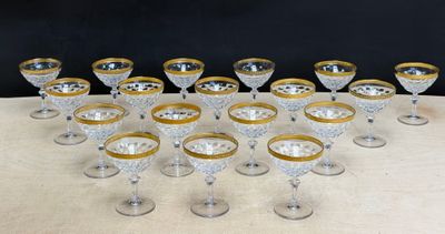 a lot of glasses that are sitting on a table
