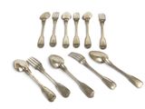 six silverplated forks and spoons are arranged on a white surface
