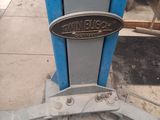a close up of a blue machine with a sign on it