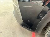 a close up of a car with a red laser on the side of it
