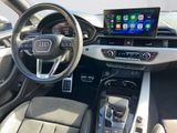 the interior of a car with a touch screen and steering controls