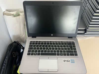 a laptop computer sitting on top of a desk