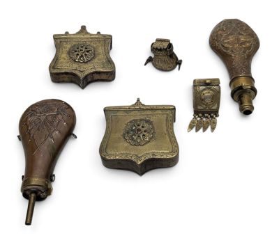 a lot of antique items that are on a white surface