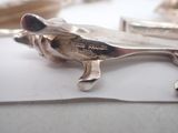 a silver spoon sitting on top of a piece of paper