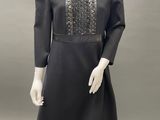 an image of a mannequin wearing a black dress and hat