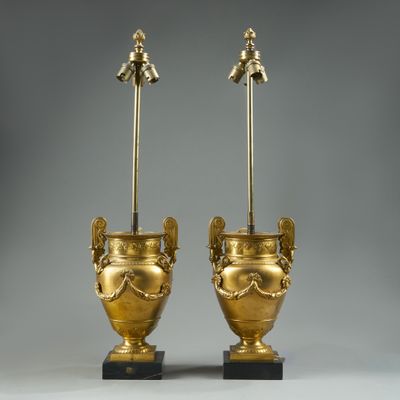 pair of antique brass urns on marble bases