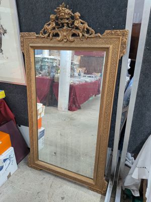 a mirror that is sitting on the floor in a room