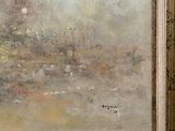 painting of a landscape in a gold frame on a wall
