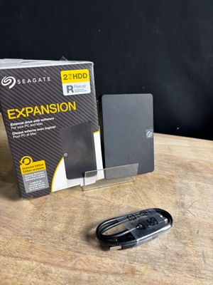 a box and a mouse on a table next to it