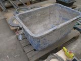 a large blue bath tub sitting on a pallet