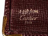 an image of a close up of a wallet on a white surface