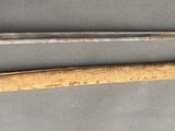 two swords that are laying next to each other on a table