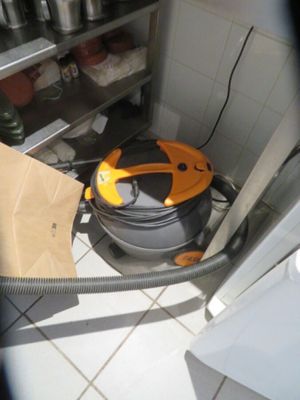 an image of a vacuum cleaner in a kitchen