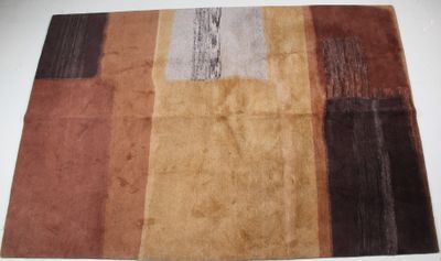 brown, brown, and black rug on a white table