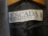 a close up of a label on a grey jacket