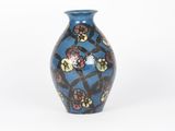 a blue vase with a floral design on it
