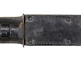 an old knife with a leather sheath on a white background