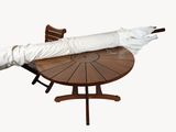 a white umbrella sitting on top of a wooden table