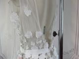 a mannequin with a white dress on display