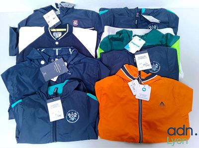 a lot of jackets that are sitting on a table