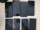 a lot of cell phones that are on the table