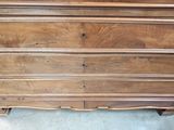 a wooden dresser that has been cleaned and is in the process of being cleaned