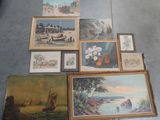 il y a beaucoup de tableaux posés par terre dans cette pièce