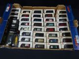 a lot of cars in a box on the table