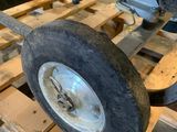 a close up of a tractor wheel on a pallet