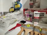 many different types of paint and brushes on the counter
