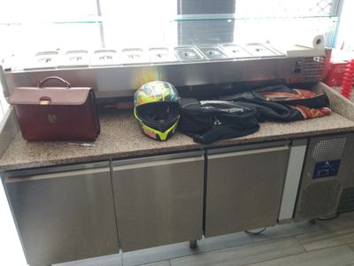 a counter with a helmet and other items on it