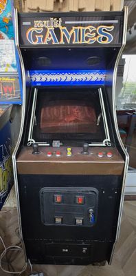 a game machine that is sitting in the corner of a room