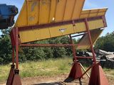 a picture of a large yellow and red dumpster
