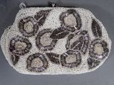 an image of a beaded purse with shells on it