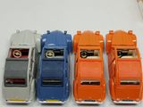 several toy cars are lined up in a row on a table