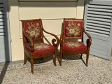 two chairs that are sitting next to each other