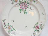 a plate with a floral design on it on a table