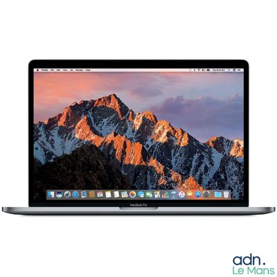an apple macbook pro laptop computer with a mountain range in the background