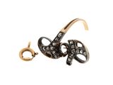 an image of a black and gold ring with a snake on it