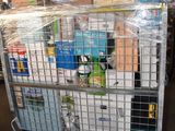 a metal cage with a bunch of items in it