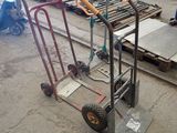 a hand truck that is sitting in the middle of a warehouse