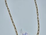 a gold link necklace with a tag attached to it