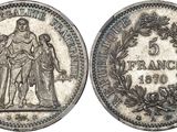 a silver coin with an image of a man and woman on it