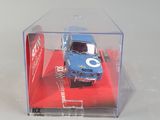 a toy car in a clear box on a white surface